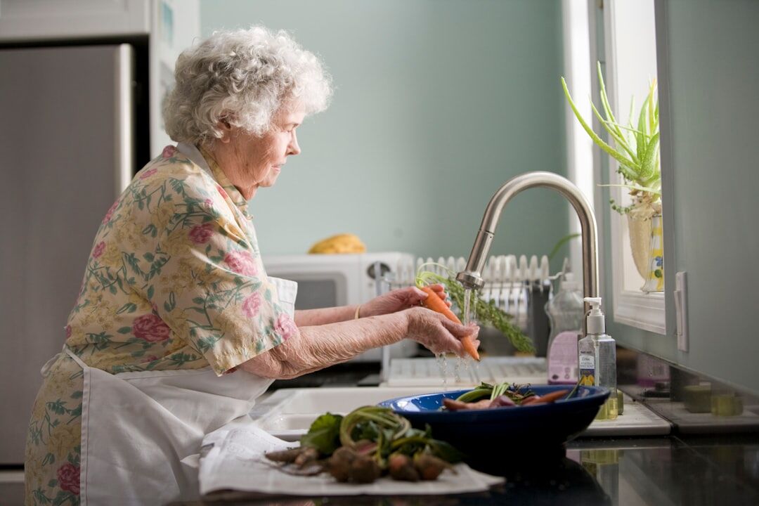 Slovak senior woman preparing a healthy meal in her kitchen