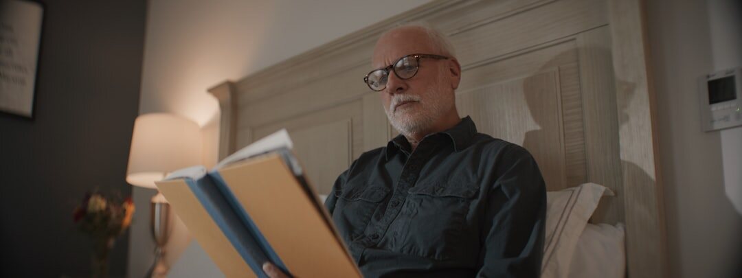 senior man reading book