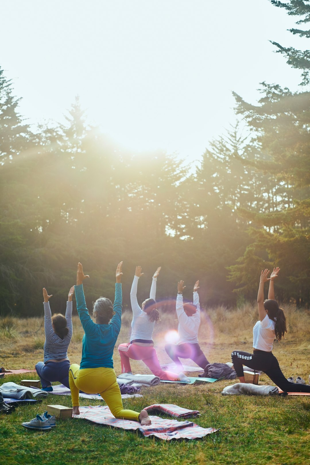 Slovak seniors practicing gentle yoga in a sunny hall