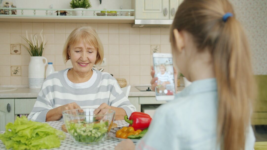 Slovak senior woman video calling on a tablet at home