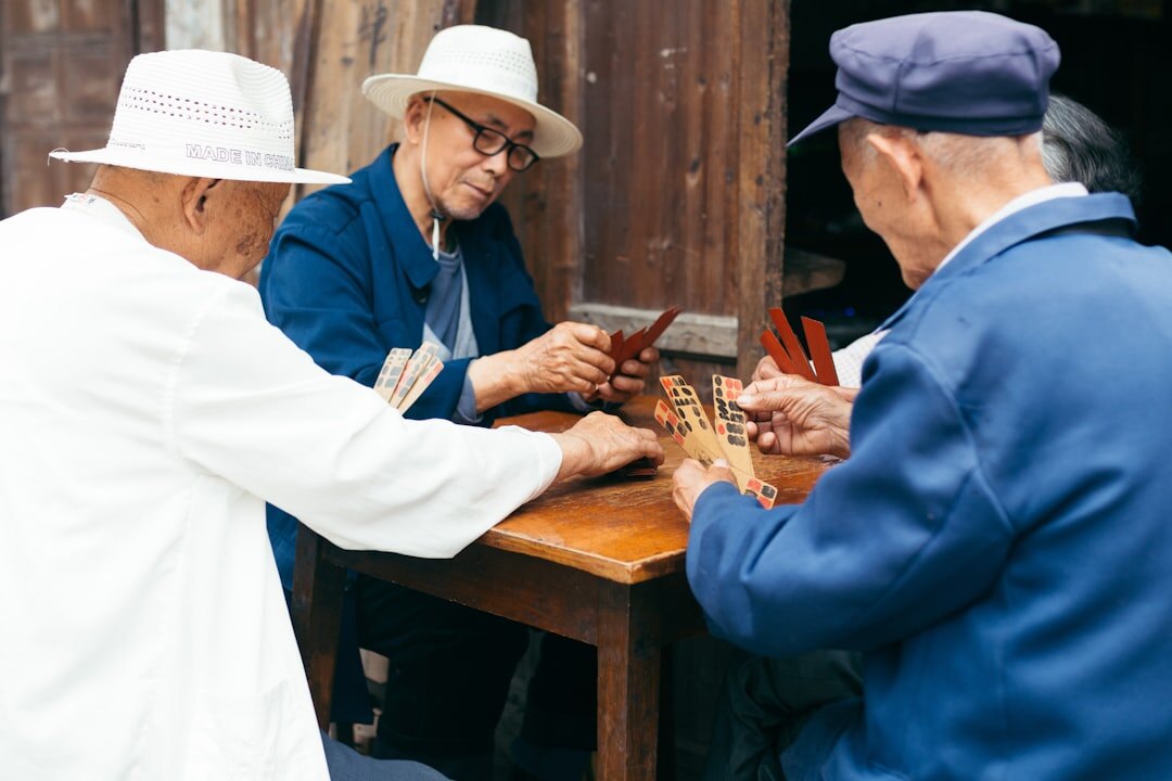 group of seniors playing cards
