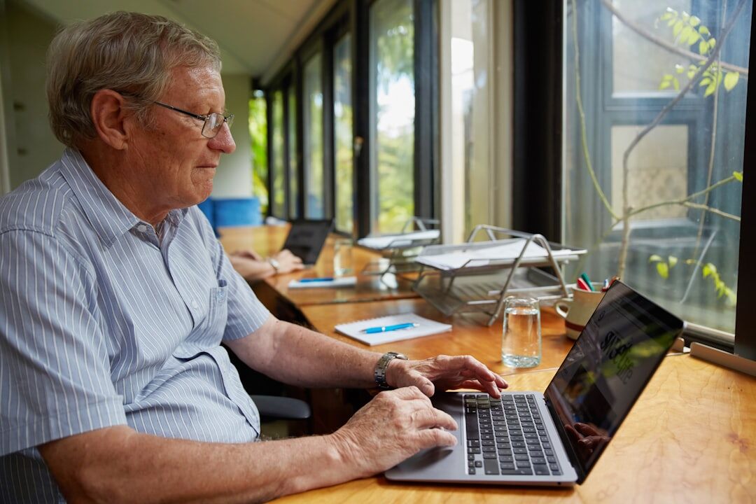 Slovak seniors learning computer skills in a classroom